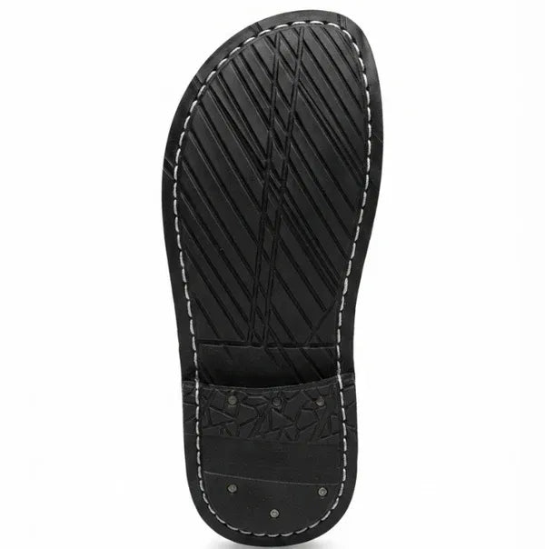 Man wearing ZERMONTE brown original leather slipper .