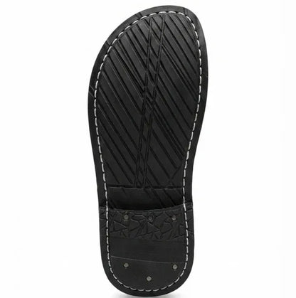 Man wearing ZERMONTE brown original leather slipper .